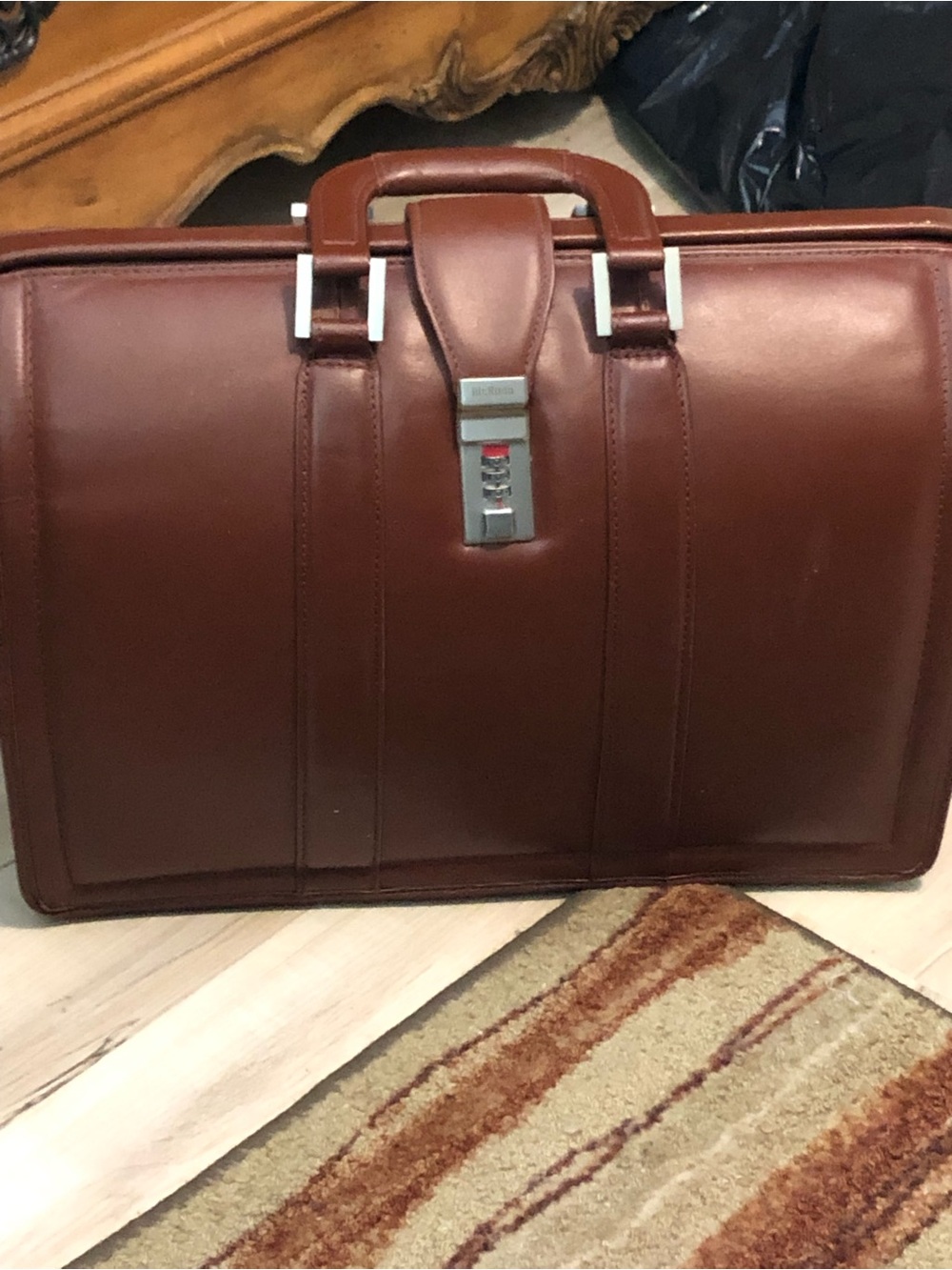 Litagator leather briefcase with security features and sturdy handles.